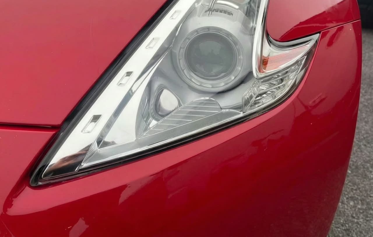 Nissan 370Z headlight crystal clear after restoration in Houston