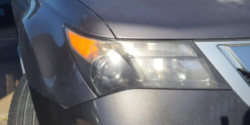 Acura headlight before restoration in Houston