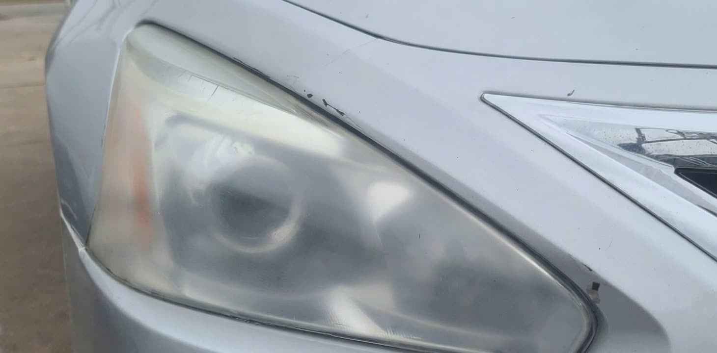 Nissan Altima headlight before restoration in Houston