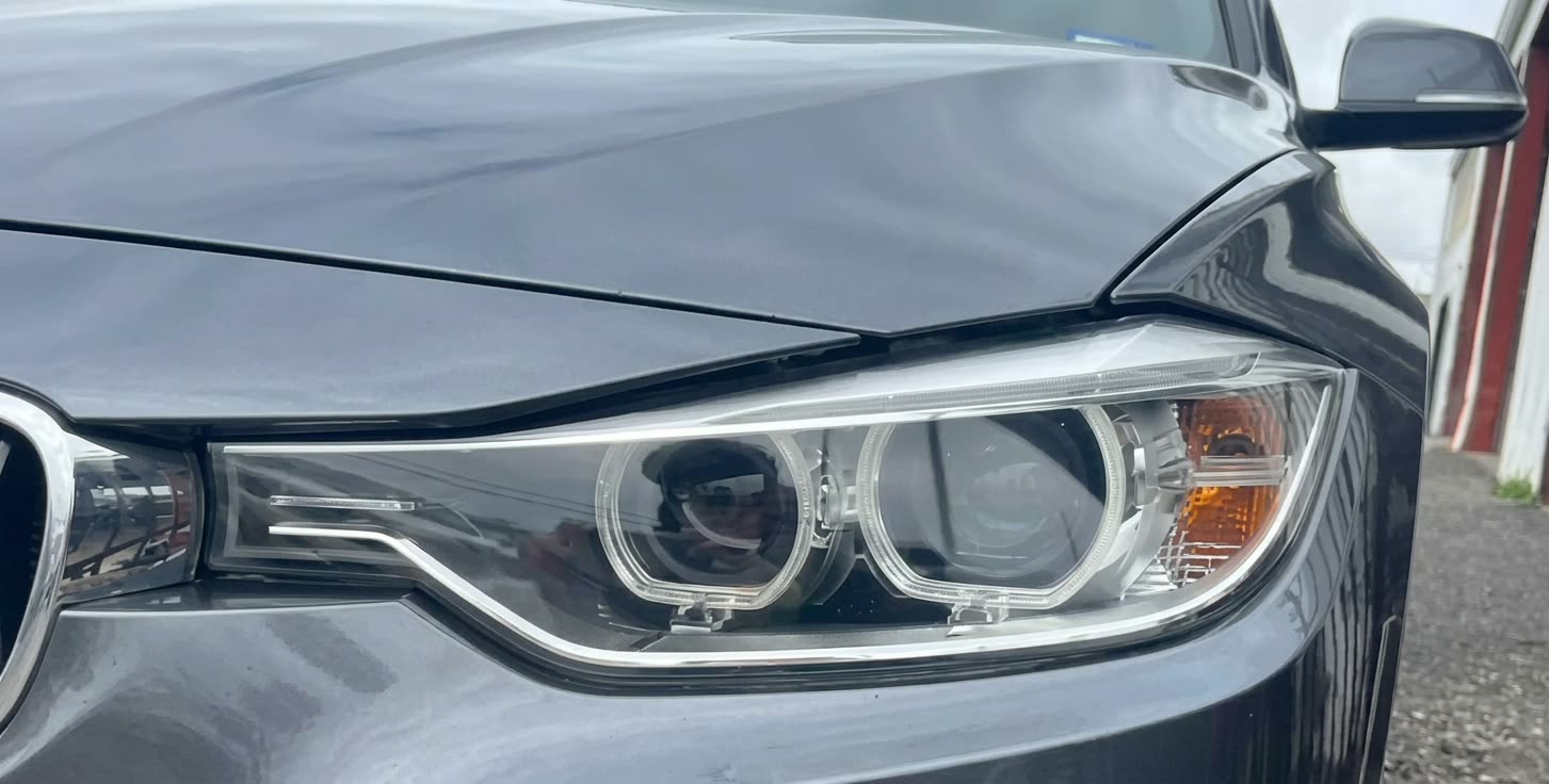 BMW headlight after professional restoration in Houston