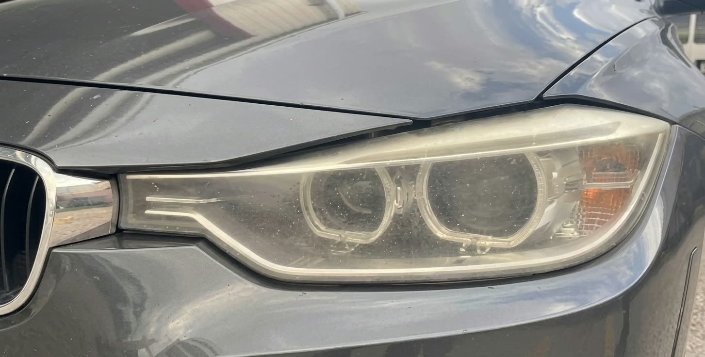 BMW headlight before restoration in Houston