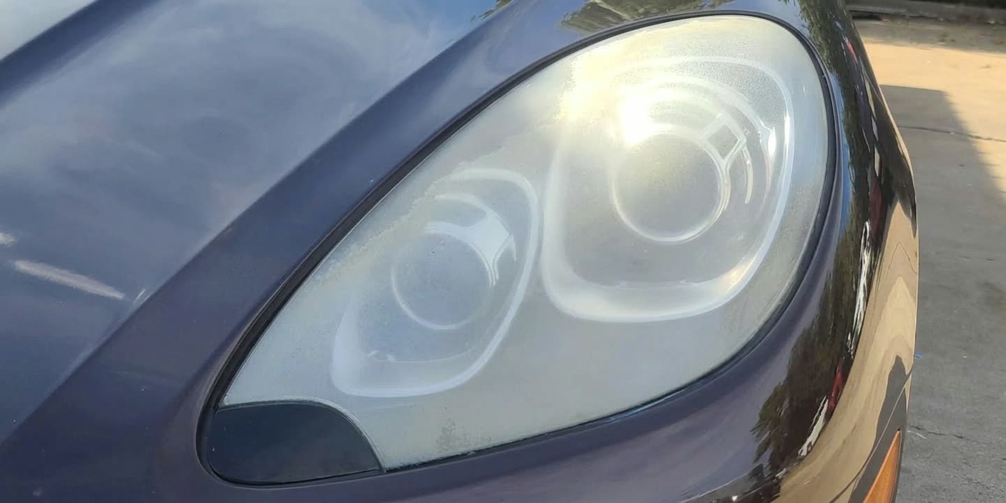 Porsche headlight before restoration in Houston