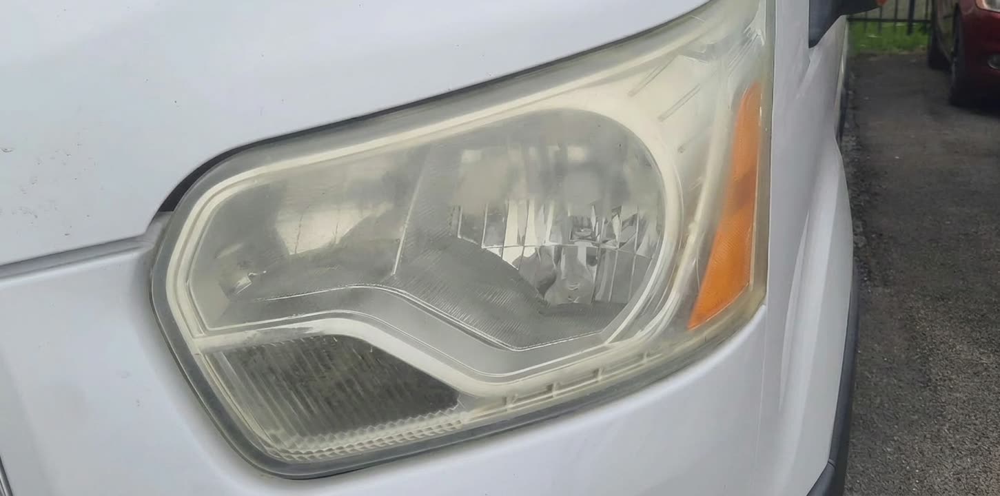 Ford Transit van headlight before restoration in Houston